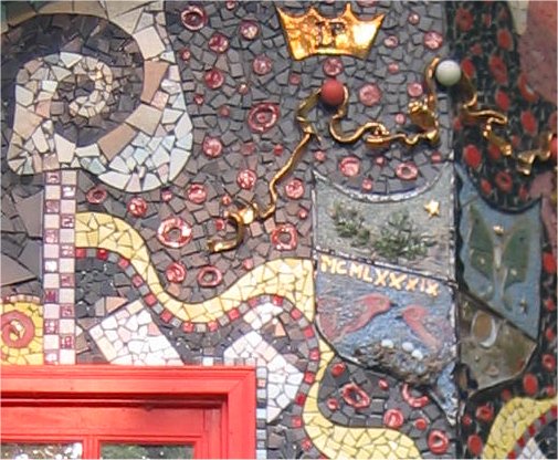 Detail of mosaic just under roofline from image on left